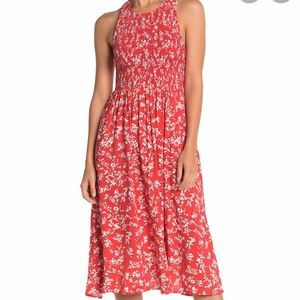 Red smocked floral midi dress